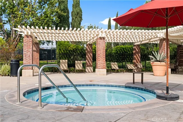 a view of a swimming pool with a patio