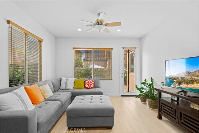 a living room with furniture and a large window