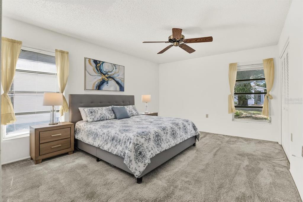 8410 Elgin Drive Port Richey, FL 34668 - Photo 21 of 37 a bedroom with a bed and a window