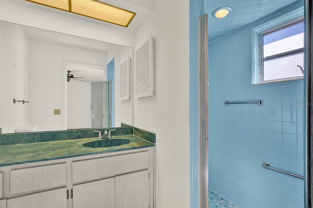 8410 Elgin Drive Port Richey, FL 34668 - Photo 24 of 37 a bathroom with a sink and a mirror