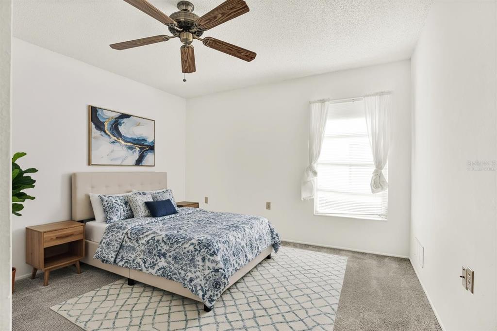 8410 Elgin Drive Port Richey, FL 34668 - Photo 25 of 37 a bedroom with a bed and a window