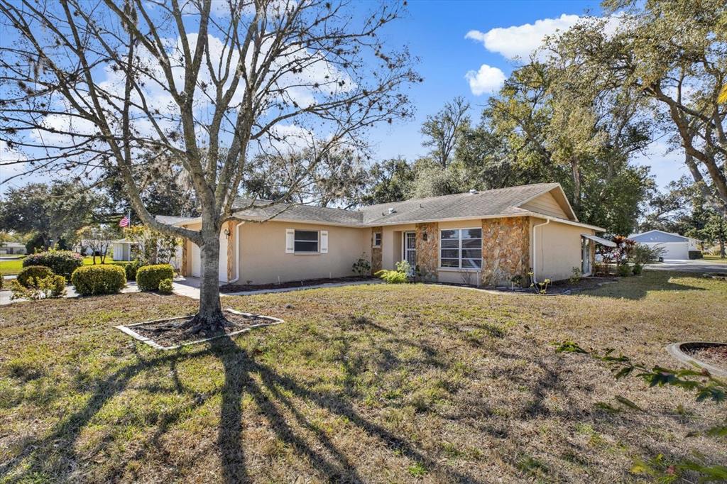 8410 Elgin Drive Port Richey, FL 34668 - Photo 31 of 37 a view of a house with a yard covered in snow