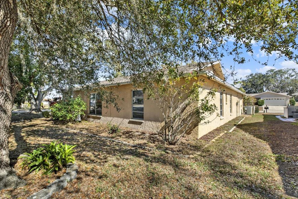 8410 Elgin Drive Port Richey, FL 34668 - Photo 33 of 37 a view of a house with a yard