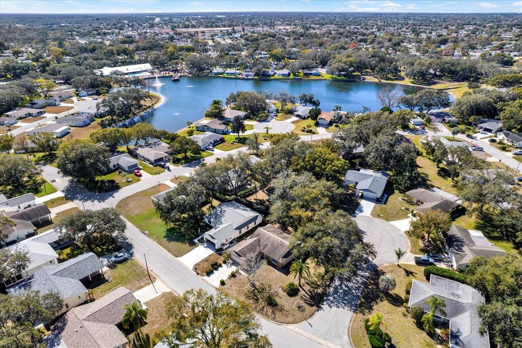 8410 Elgin Drive Port Richey, FL 34668 - Photo 35 of 37 an aerial view of a city with lots of residential buildings and ocean view in back