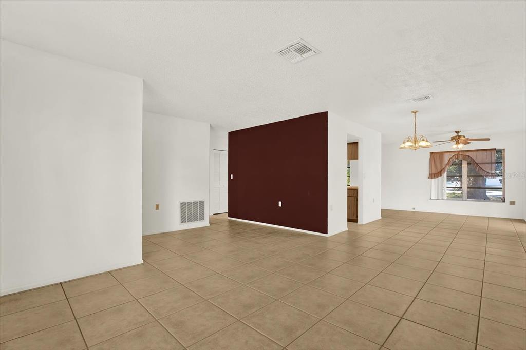 8410 Elgin Drive Port Richey, FL 34668 - Photo 10 of 37 a view of a livingroom and a empty room