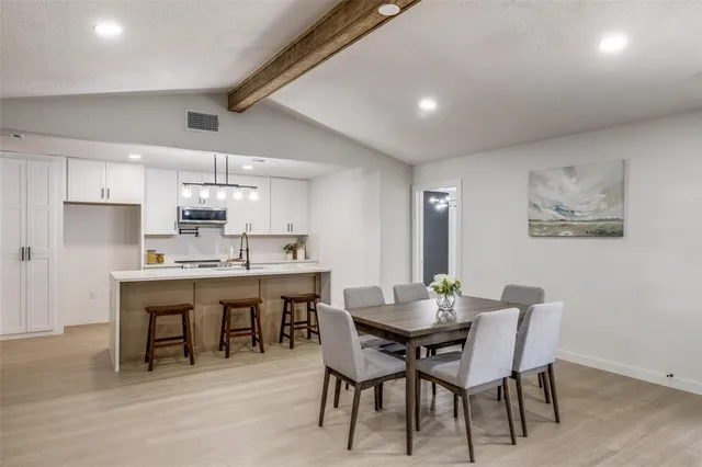 a view of a dining room with furniture