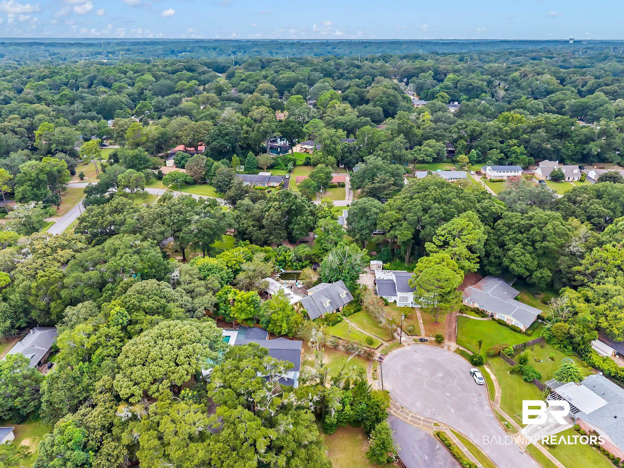 4705 Sherry Court Mobile, AL 36693 - Photo 85 of 100 Aerial perspective of suburban area with a forest