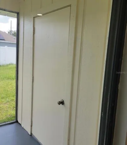 a bathroom with a glass shower door