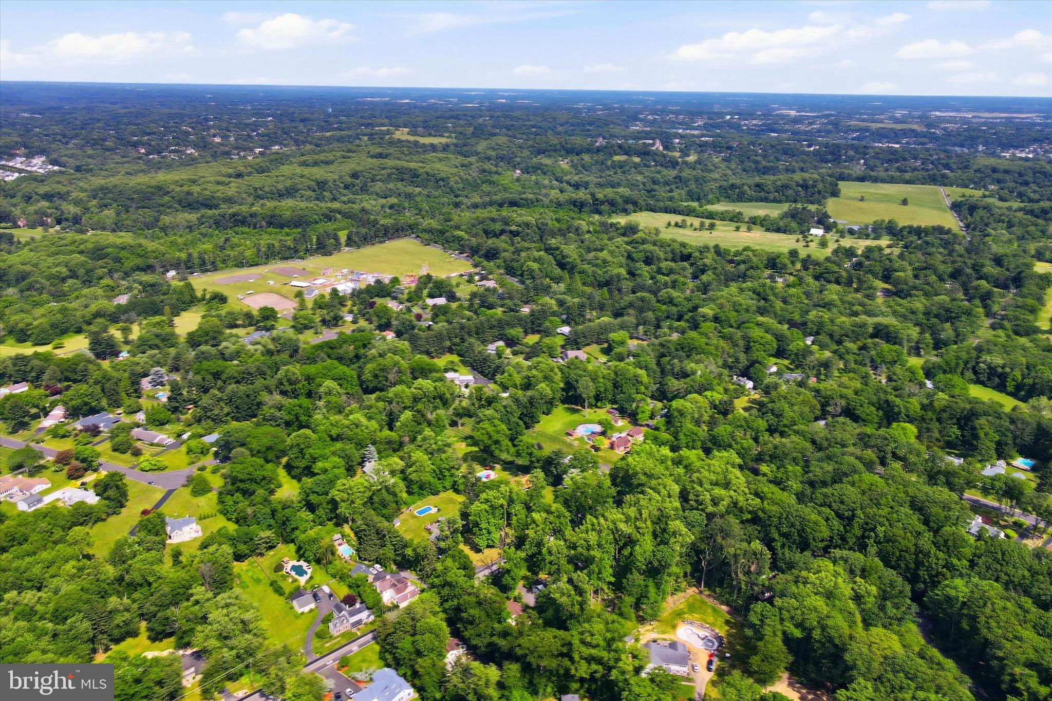 1980 Terwood Road Huntingdon Valley, PA 19006 - Photo 37 of 48 a view of a city with lush green forest