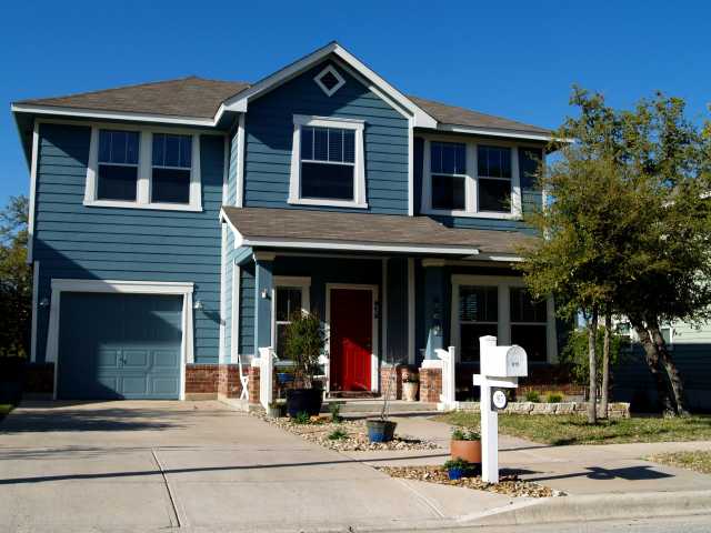 a front view of a house with street