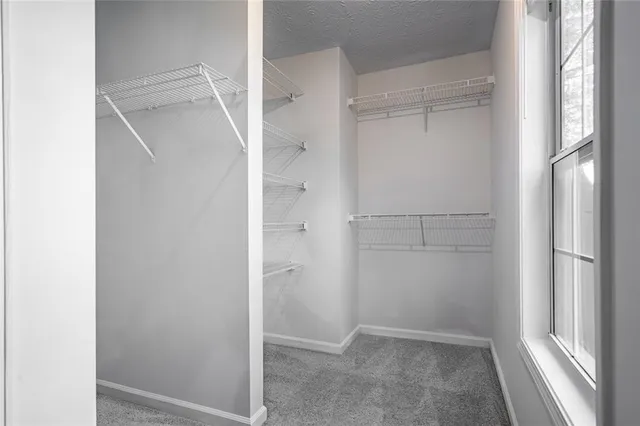 a bathroom with a granite countertop toilet a sink and bathtub