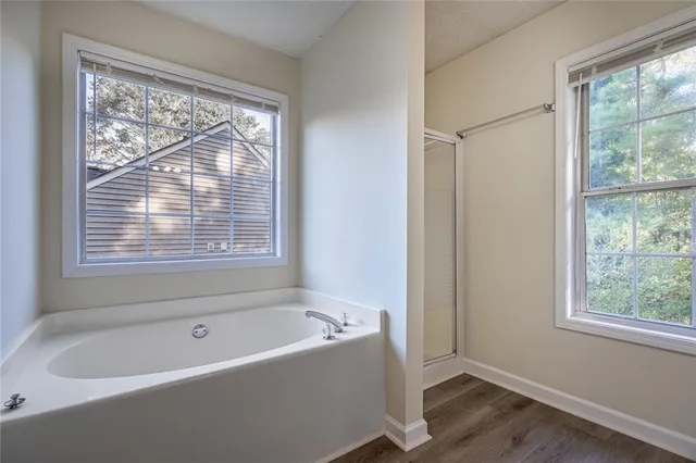 a bathroom with a toilet a sink a mirror and vanity