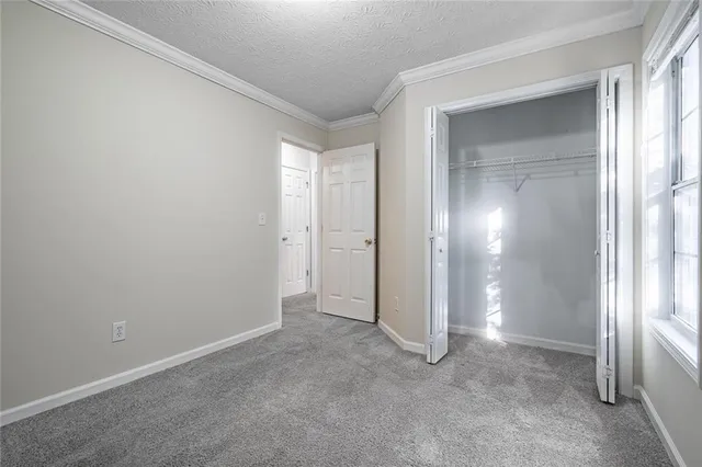 a picture of a wall with a white wall and white cabinet