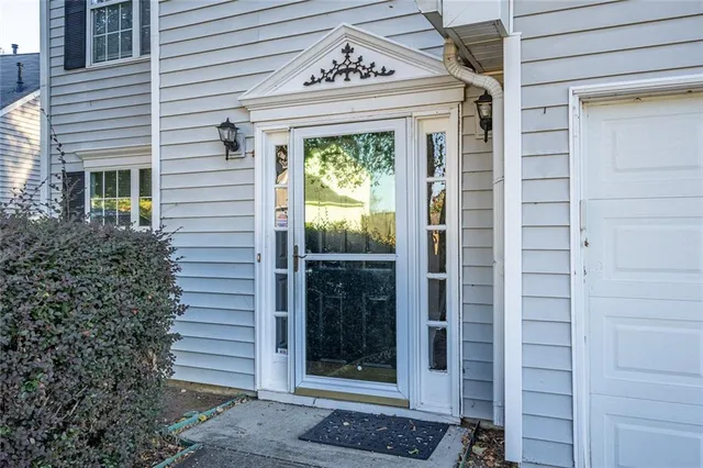 a view of front door and potted plants