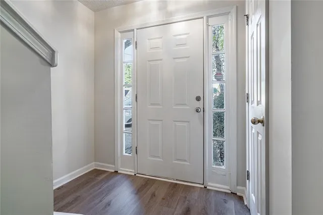 a view of a bathroom with wooden floor
