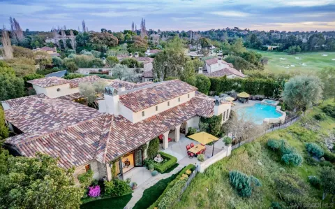 an aerial view of multiple house with a yard