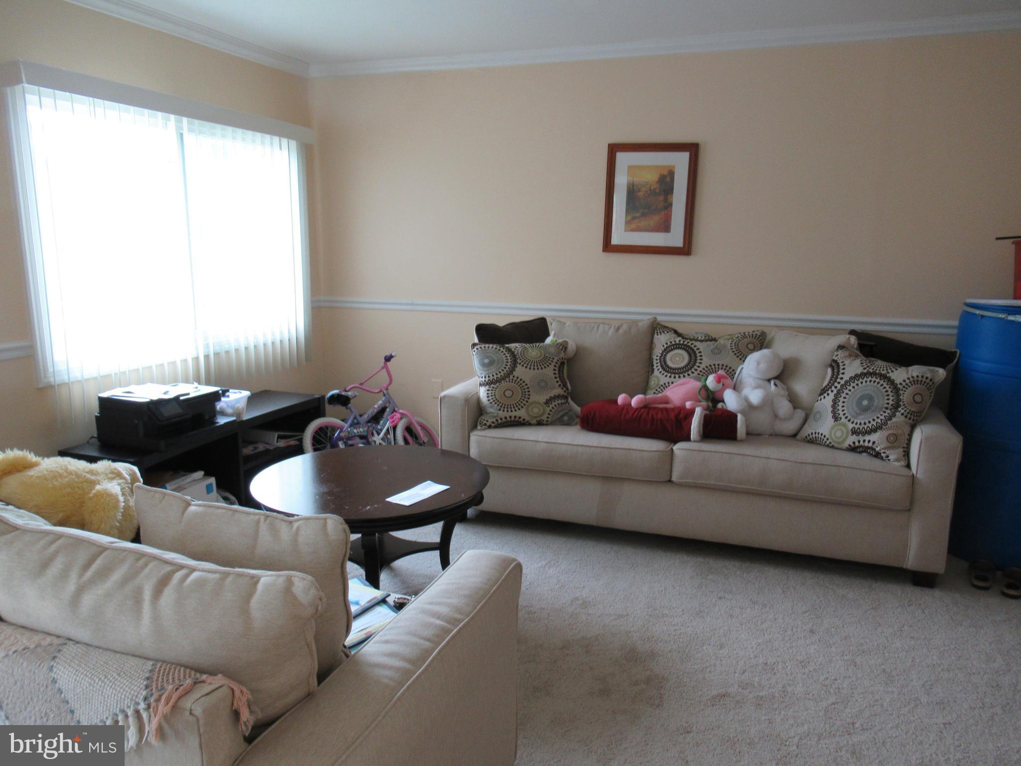 3812 Bel Pre Road, Unit 9 Silver Spring, MD 20906 - Photo 4 of 12 Living rm w/vinyl wdws, crown molding, chair rail