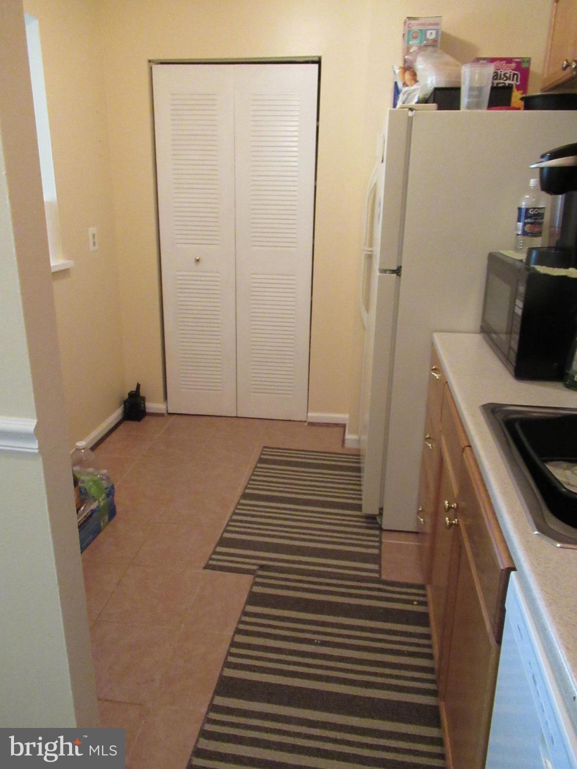 3812 Bel Pre Road, Unit 9 Silver Spring, MD 20906 - Photo 6 of 12 Kit. Newer gas stove Table space area. Tile floor.