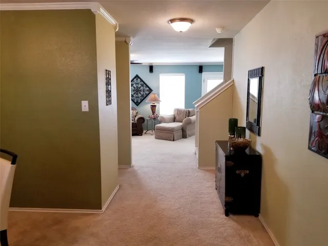 a view of a room with a table and a chair