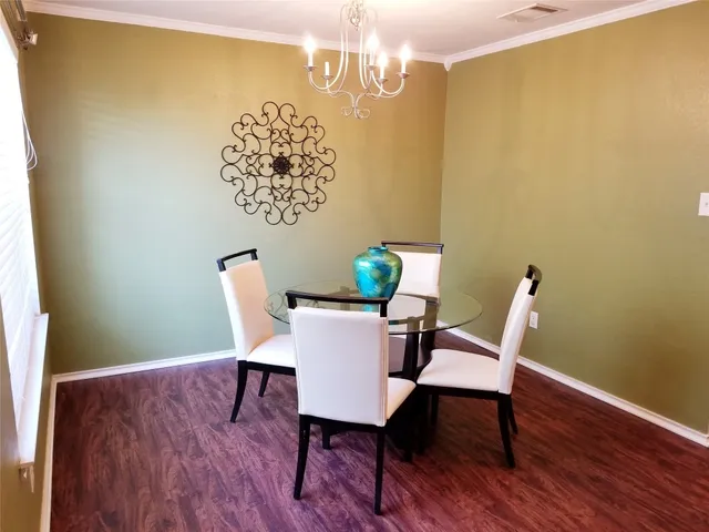 a large bed sitting in a bedroom next to a window