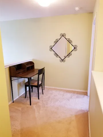 a view of a room that has a window in it