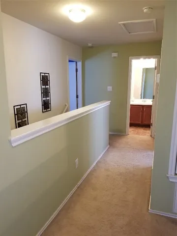 a bedroom with a bed and a table