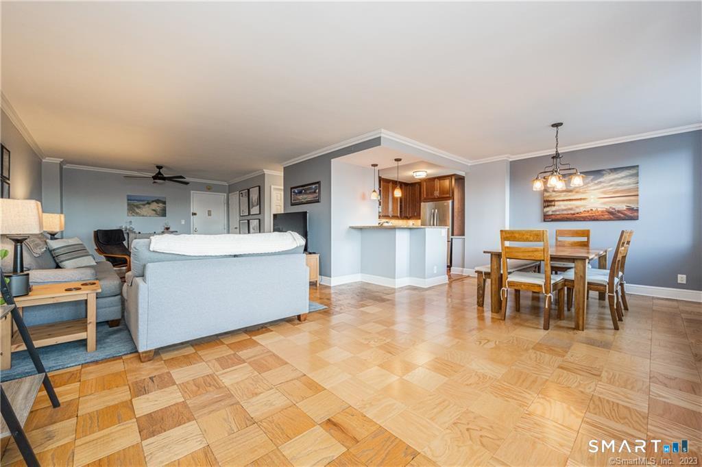 50 Glenbrook Road, Unit 6E Stamford, CT 06902 - Photo 6 of 18 a living room with furniture a dining table and kitchen view