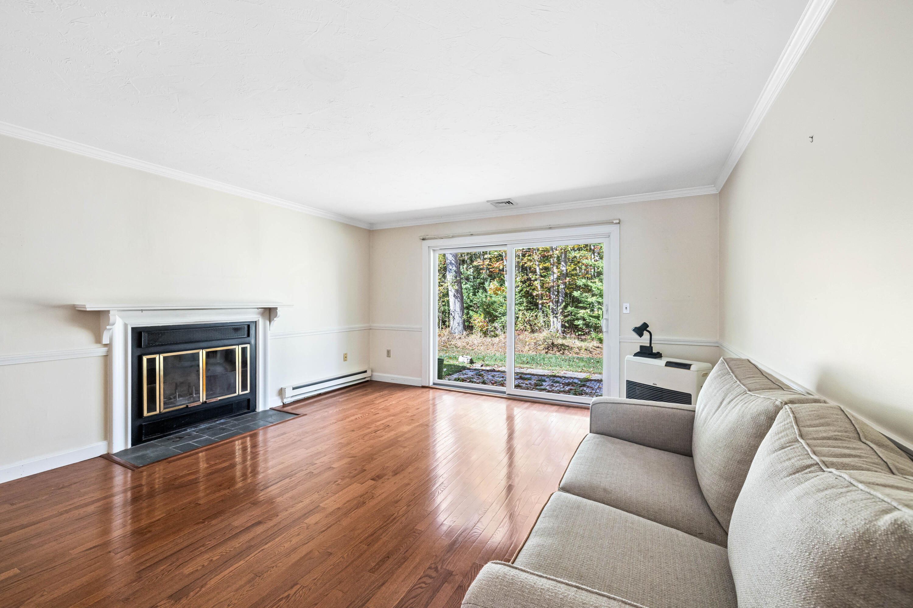 30 Stratton Road, Unit 30 Scarborough, ME 04074 - Photo 12 of 26 Living room with wood fireplace