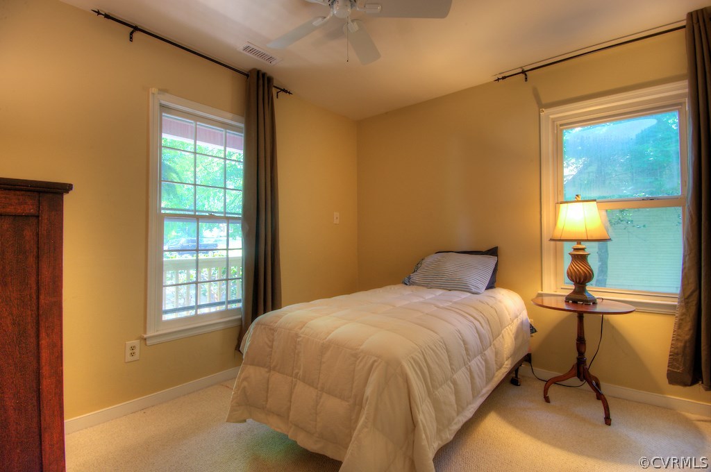 8430 Boones Trail Road Chesterfield, VA 23832 - Photo 15 of 24 a bedroom with a bed and a lamp