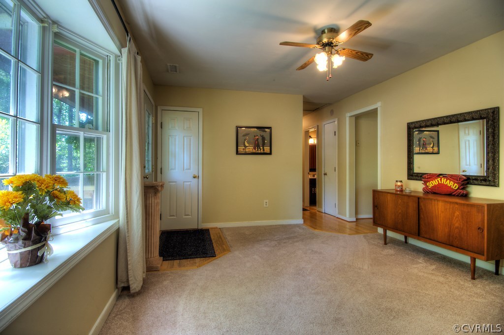 8430 Boones Trail Road Chesterfield, VA 23832 - Photo 5 of 24 a view of a workspace with furniture and a chandelier fan