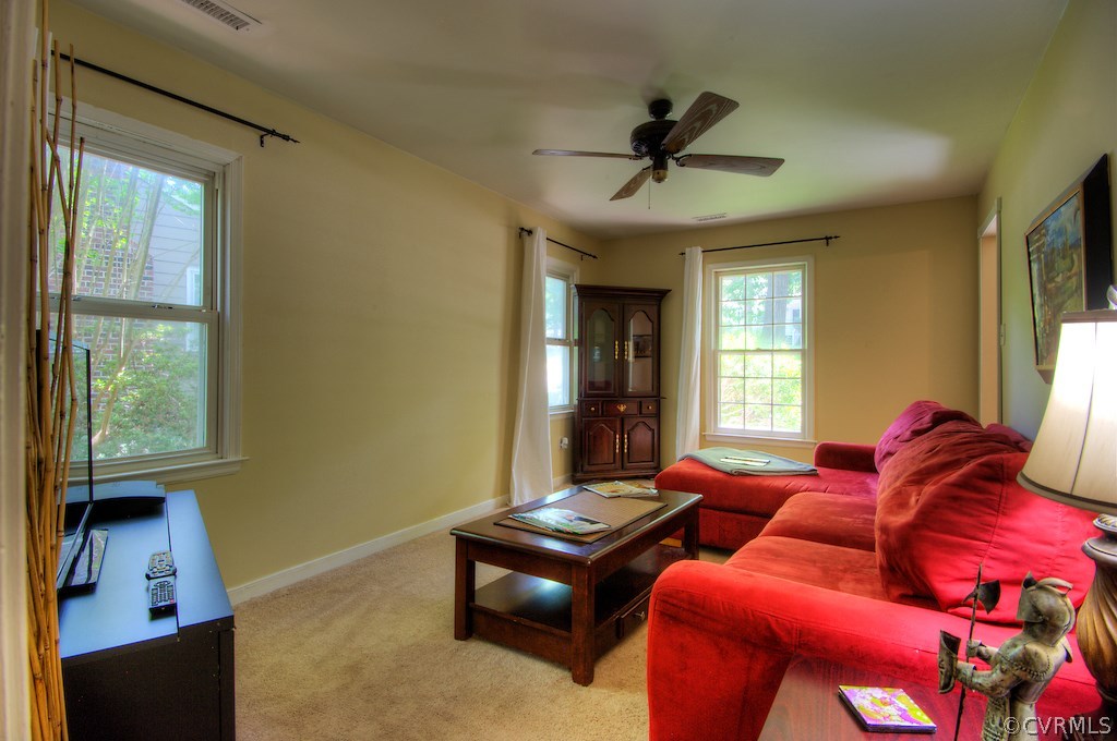 8430 Boones Trail Road Chesterfield, VA 23832 - Photo 9 of 24 a living room with furniture a ceiling fan and a window