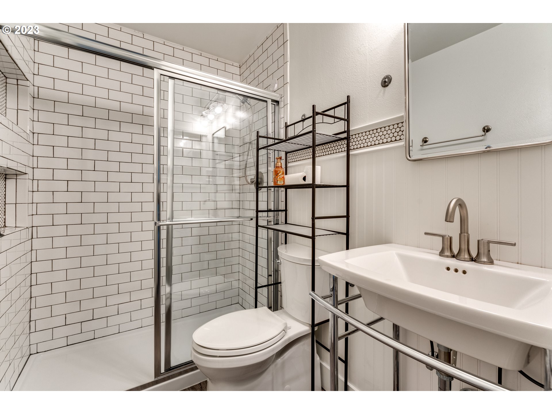 8421 Southwest 30th Avenue Portland, OR 97219 - Photo 14 of 28 a bathroom with a sink toilet and shower