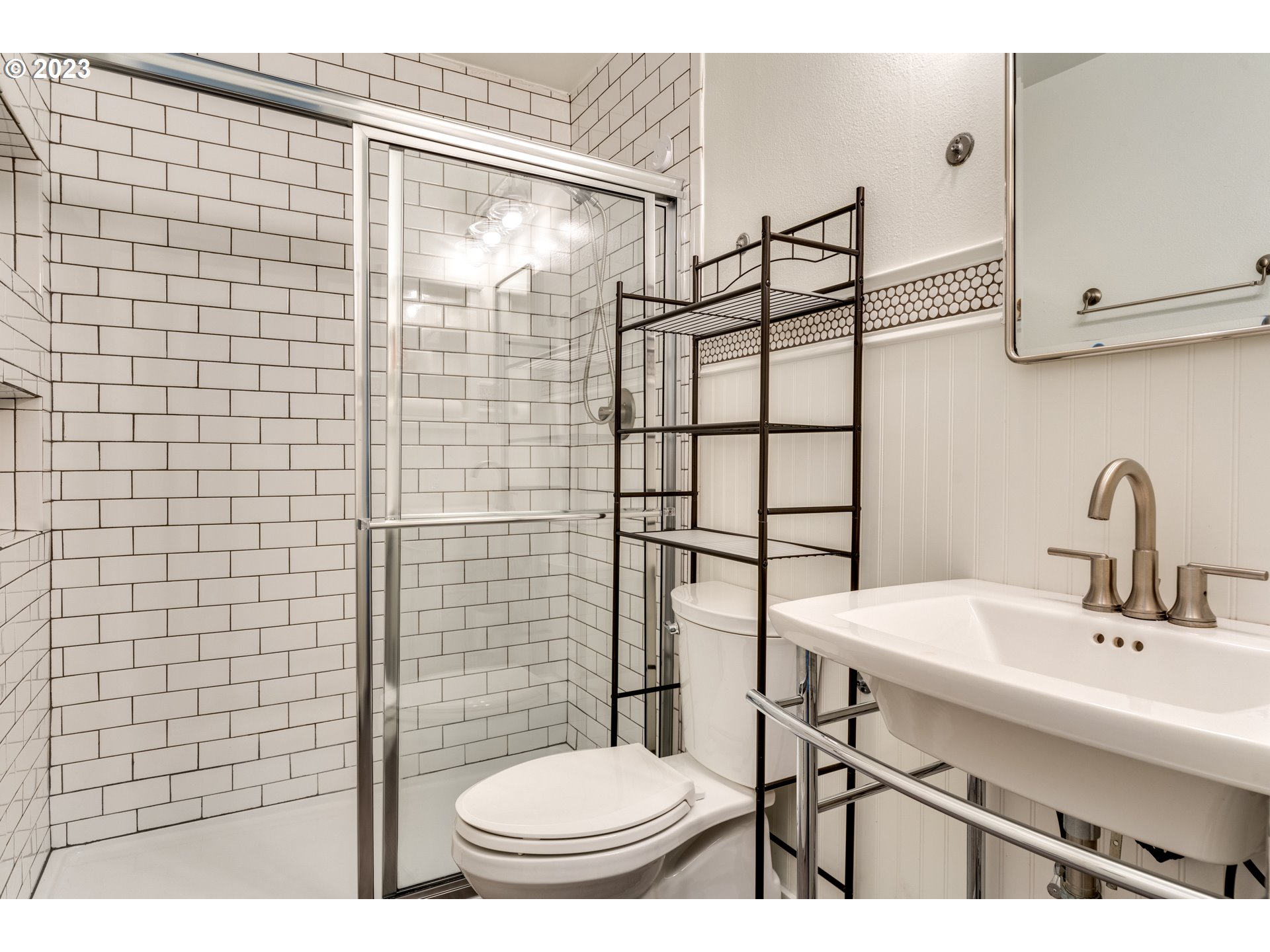 8421 Southwest 30th Avenue Portland, OR 97219 - Photo 15 of 28 a bathroom with a sink toilet and shower
