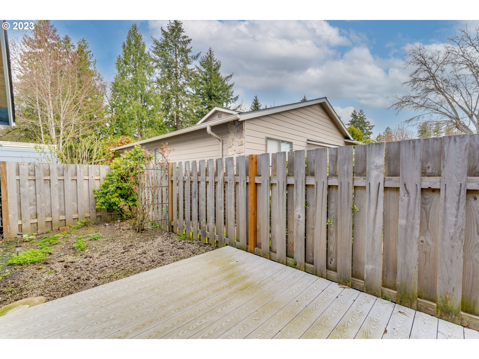 8421 Southwest 30th Avenue Portland, OR 97219 - Photo 21 of 28 a road view with wooden fence