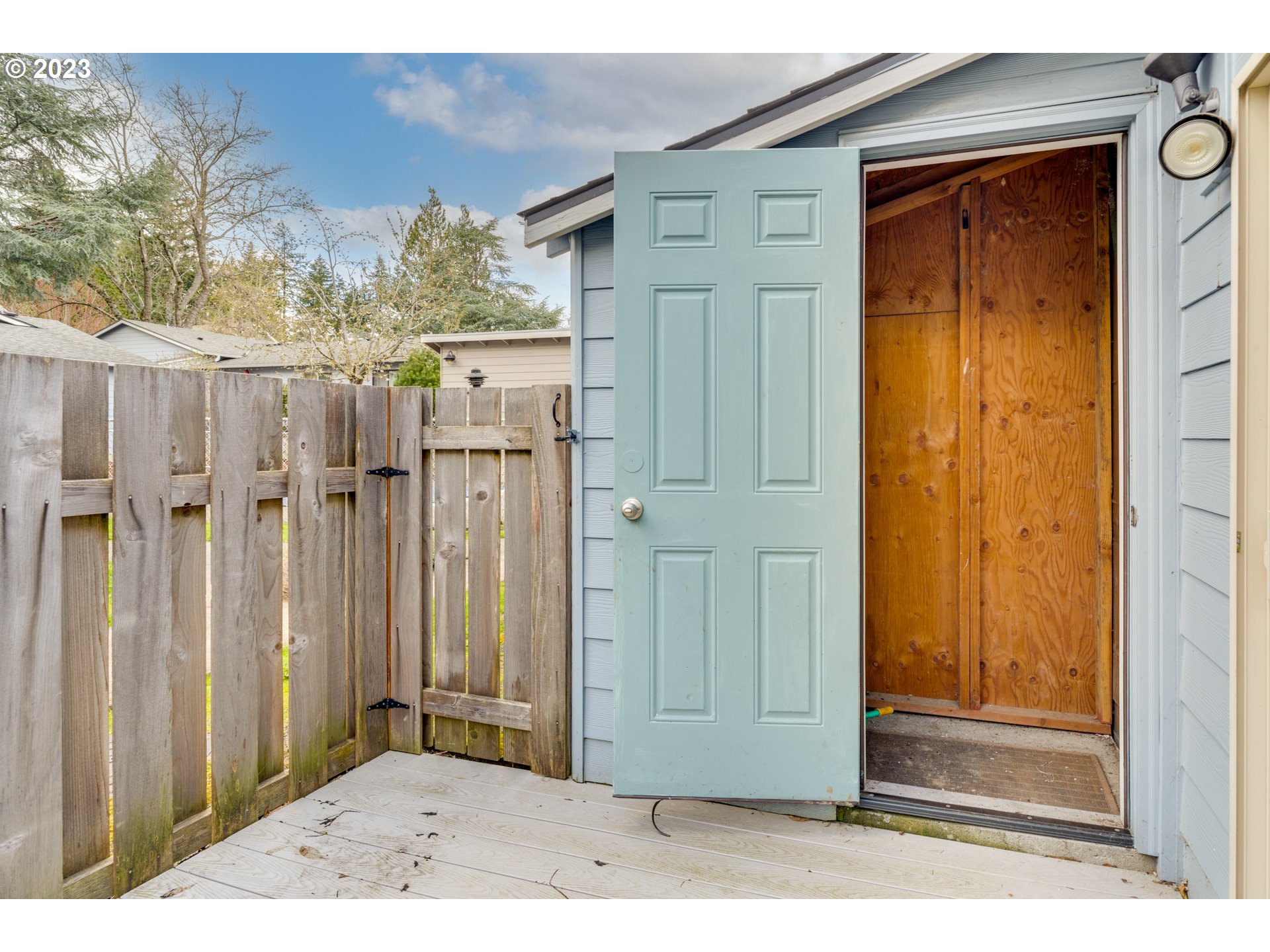 8421 Southwest 30th Avenue Portland, OR 97219 - Photo 26 of 28 a view of a house with wooden fence