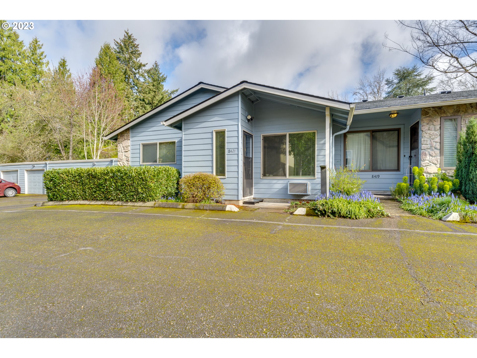 8421 Southwest 30th Avenue Portland, OR 97219 - Photo 3 of 28 a front view of a house with garden