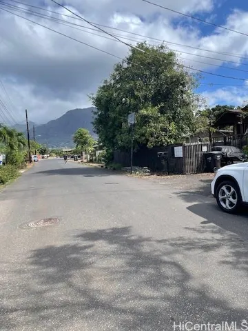 a view of a car parked in back of a house