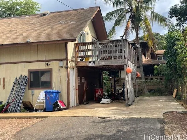 a view of a chairs and table in the patio