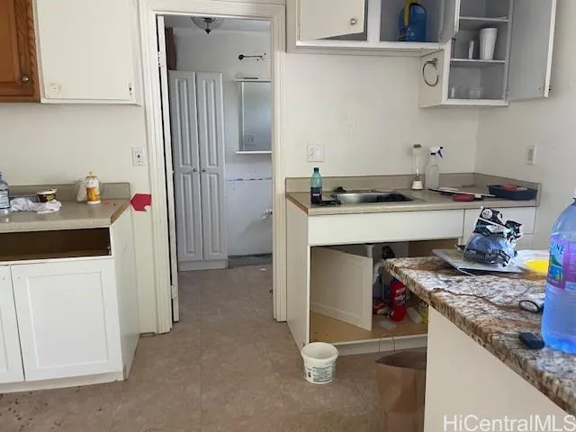 a kitchen that has a sink and a stove