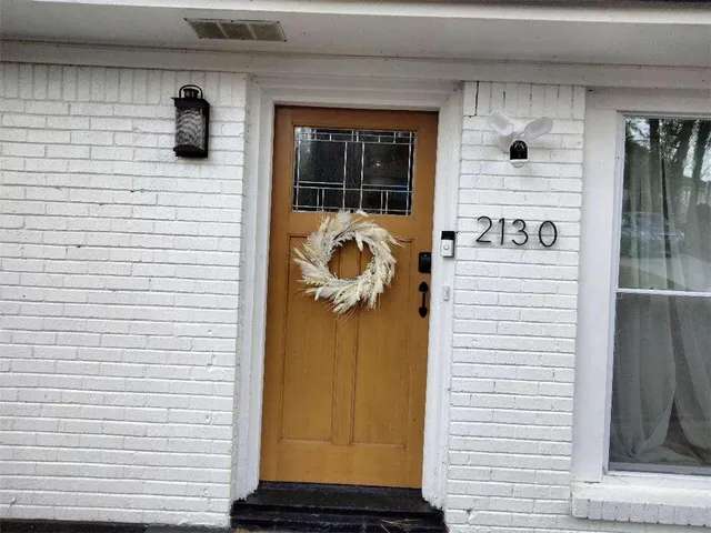 a front view of a house with yard porch and furniture
