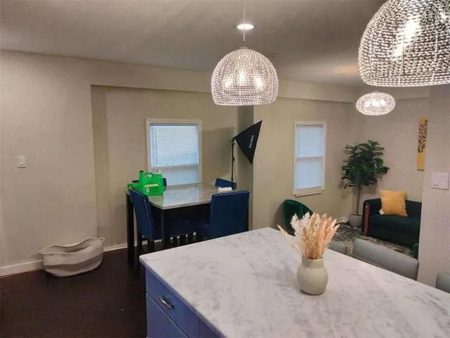 a view of a bedroom with a bed and a couch