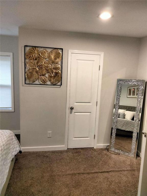 2130 Keheley Drive Decatur, GA 30032 - Photo 12 of 23 a view of a bedroom with a bed and a couch