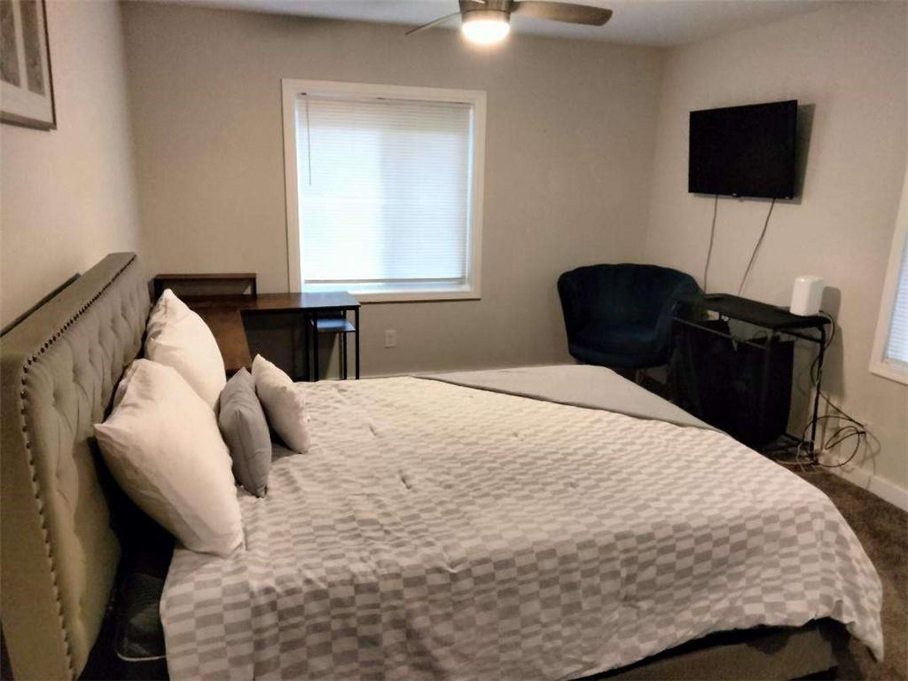 2130 Keheley Drive Decatur, GA 30032 - Photo 15 of 23 a bedroom with a bed and a flat screen tv