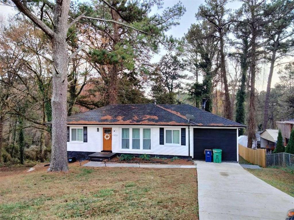 2130 Keheley Drive Decatur, GA 30032 - Photo 2 of 23 a front view of a house with yard porch and furniture