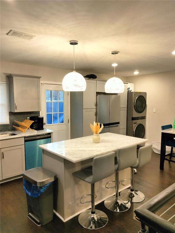 2130 Keheley Drive Decatur, GA 30032 - Photo 4 of 23 a large kitchen with a table and chairs