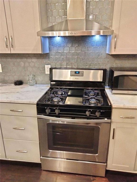 2130 Keheley Drive Decatur, GA 30032 - Photo 5 of 23 a stove top oven sitting inside of a kitchen