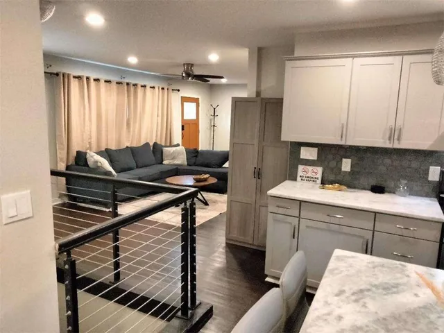 a dining room with a table and chairs