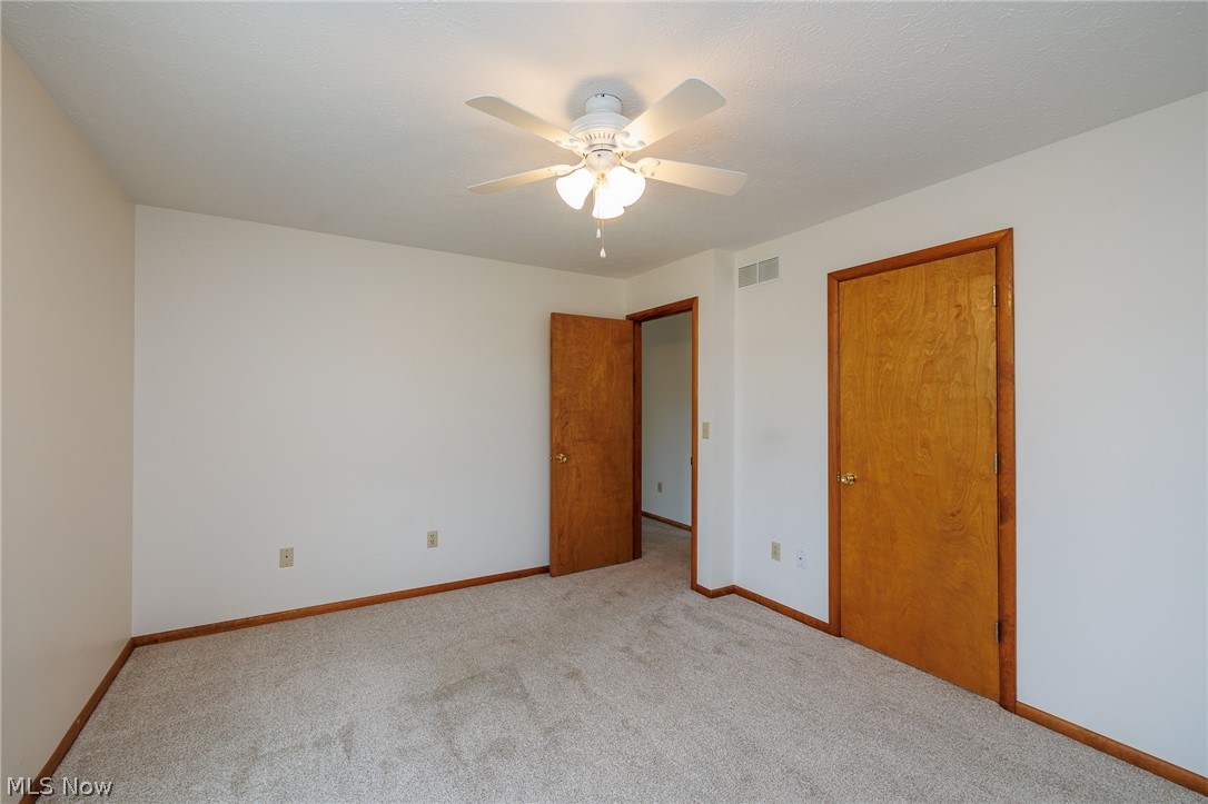 39816 Butternut Ridge Road Elyria, OH 44035 - Photo 28 of 45 Unfurnished bedroom featuring light colored carpet and ceiling fan