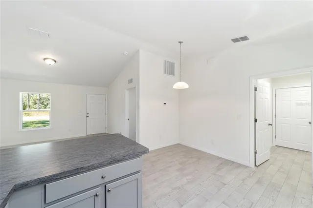 a view of a kitchen and window