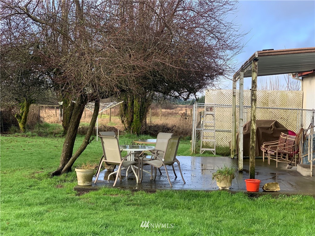 312 Meier Road Winlock, WA 98596 - Photo 5 of 18 a view of a chairs and table in backyard